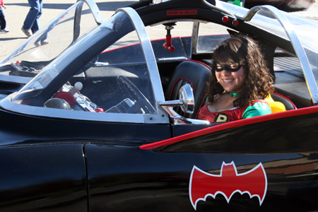 Robin fan sits in Batmobile